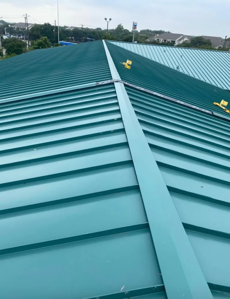 Green commercial metal roof ridge and valley for Metal Roof Repair in Fountainebleau